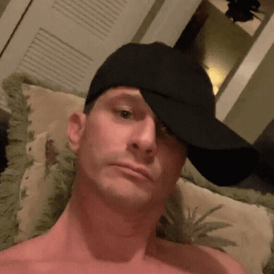 Shirtless Man In Black Hat Covering Face GIF