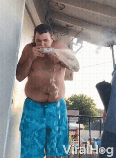 Shirtless Man In Blue Shorts Drinking Water GIF
