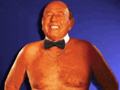 Shirtless Man In Bow Tie And Chain GIF
