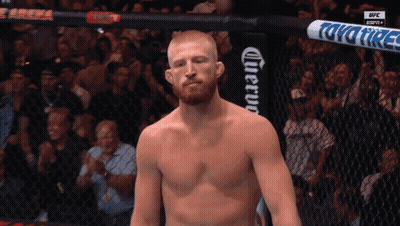Shirtless Man In Cage With UFC Banner GIF