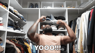 Shirtless Man In Closet With Yooo On Back GIF