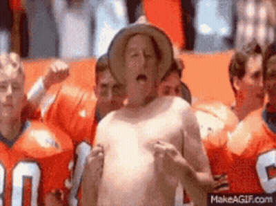 Shirtless Man In Cowboy Hat With Group In Orange Jerseys GIF