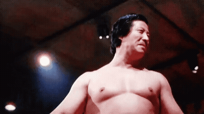Shirtless Man In Dark Room With Red Light GIF
