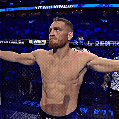 Shirtless Man In Front Of Bell Center Banner GIF