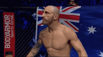 Shirtless Man In Front Of BodyArmor Sign GIF