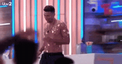Shirtless Man In Front Of Crowd GIF
