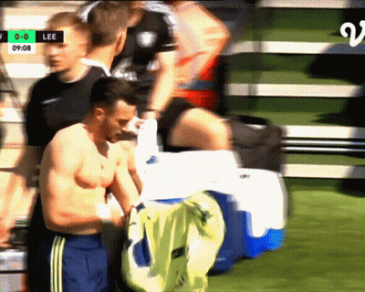 Shirtless Man In Front Of Lee Scoreboard GIF