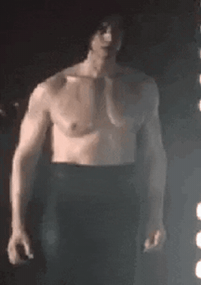 Shirtless Man In Front Of Light GIF