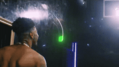 Shirtless Man In Front Of Mirror With Green Light GIF
