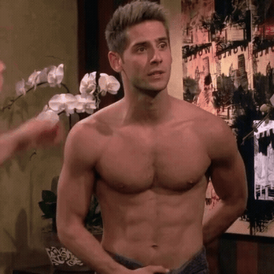 Shirtless Man In Front Of New York Wall GIF