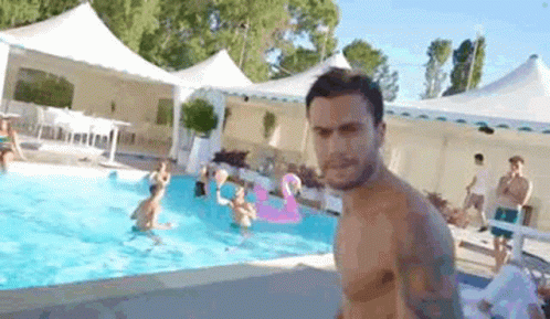 Shirtless Man In Front Of Pool GIF