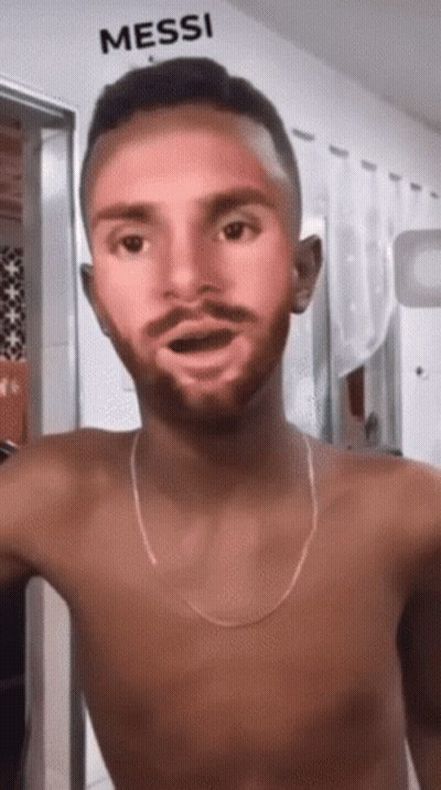 Shirtless Man In Front Of Wall Saying Messi GIF