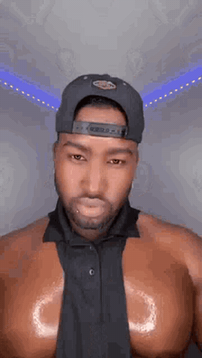 Shirtless Man In Hat And Tie GIF
