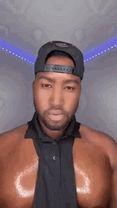 Shirtless Man In Hat And Tie GIF