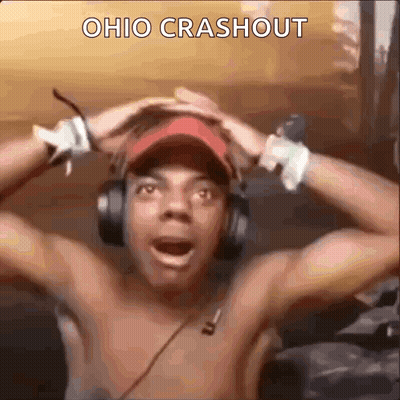 Shirtless Man In Headphones And Red Hat Holding Head GIF
