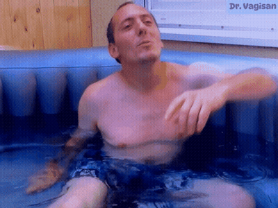 Shirtless Man In Hot Tub With Dr. Vagisan GIF