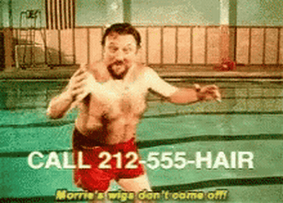 Shirtless Man In Red Shorts Jumping Into Pool GIF