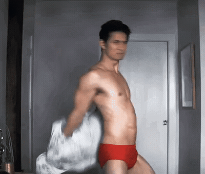 Shirtless Man In Red Underwear Holding Pillow GIF