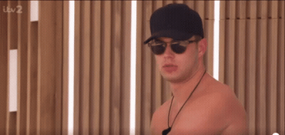 Shirtless Man In Sunglasses And Baseball Cap GIF