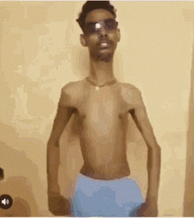Shirtless Man In Sunglasses And Blue Shorts GIF