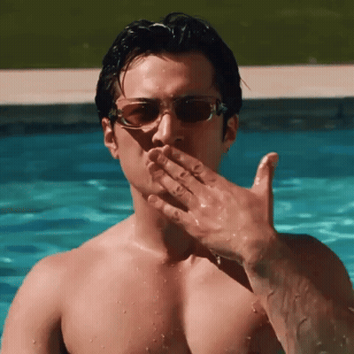 Shirtless Man In Sunglasses Blowing A Kiss GIF