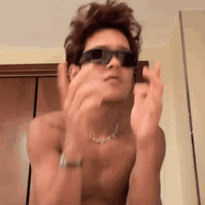 Shirtless Man In Sunglasses Making Funny Face GIF