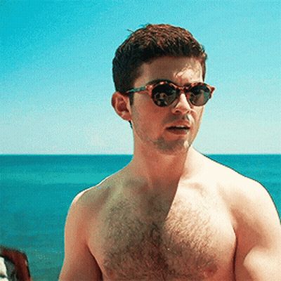 Shirtless Man In Sunglasses On Beach GIF
