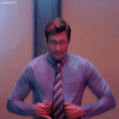 Shirtless Man In Tie And Glasses Taking Off Shirt GIF