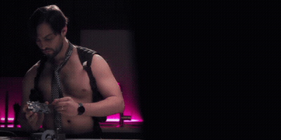 Shirtless Man In Tie Holding Controller With NSFW Teardowns GIF