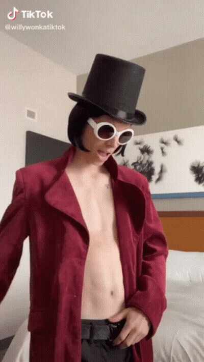 Shirtless Man In Top Hat And Sunglasses GIF