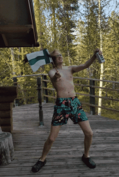 Shirtless Man In Trunks Holding Flag And Beer T GIF