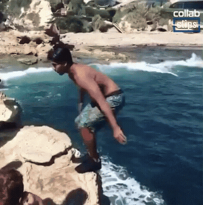 Shirtless Man Jumping Into Ocean GIF