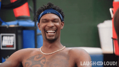 Shirtless Man Laughing At Laugh Out Loud Sign GIF