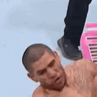 Shirtless Man Laying Next To Pink Box GIF