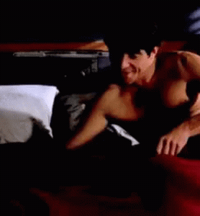 Shirtless Man Laying On Bed GIF