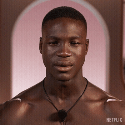 Shirtless Man Looking At Camera With Netflix Logo GIF