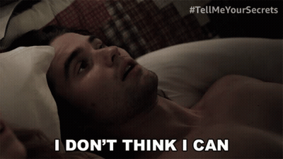 Shirtless Man Lying In Bed Saying I Don't Think I Can GIF