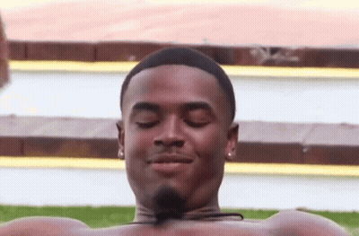Shirtless Man Lying In Pool Eyes Closed Smiling GIF