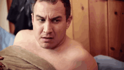 Shirtless Man Lying On Bed With Towel GIF