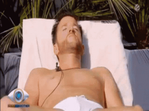 Shirtless Man Lying On Chair GIF