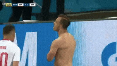 Shirtless Man Next To Man With Number 7 GIF