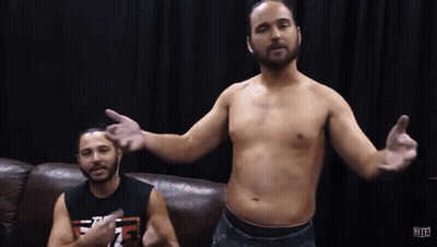 Shirtless Man Next To Man With T.F.F. Shirt GIF