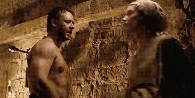 Shirtless Man Next To Woman In Dark Room GIF