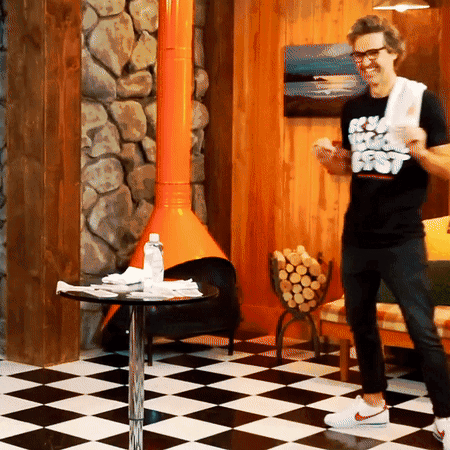 Shirtless Man On Dresser In Blue Shorts GIF