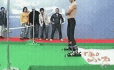 Shirtless Man On Green Carpet With Crowd GIF