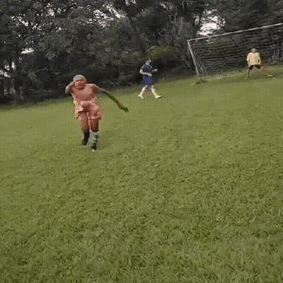 Shirtless Man On Soccer Field In Shorts And Socks GIF