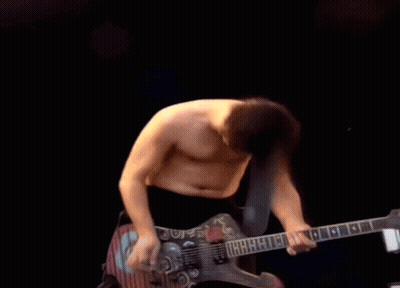 Shirtless Man Playing Guitar With Letter G GIF