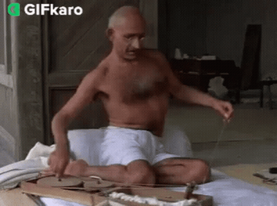 Shirtless Man Playing Instrument GIF