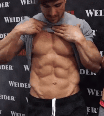 Shirtless Man Revealing Muscles GIF