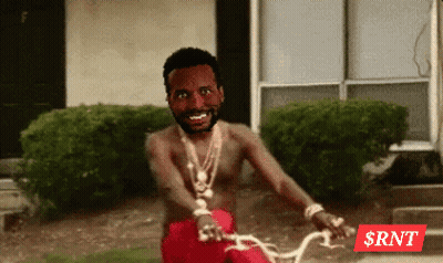 Shirtless Man Riding Bike With RNT Logo GIF